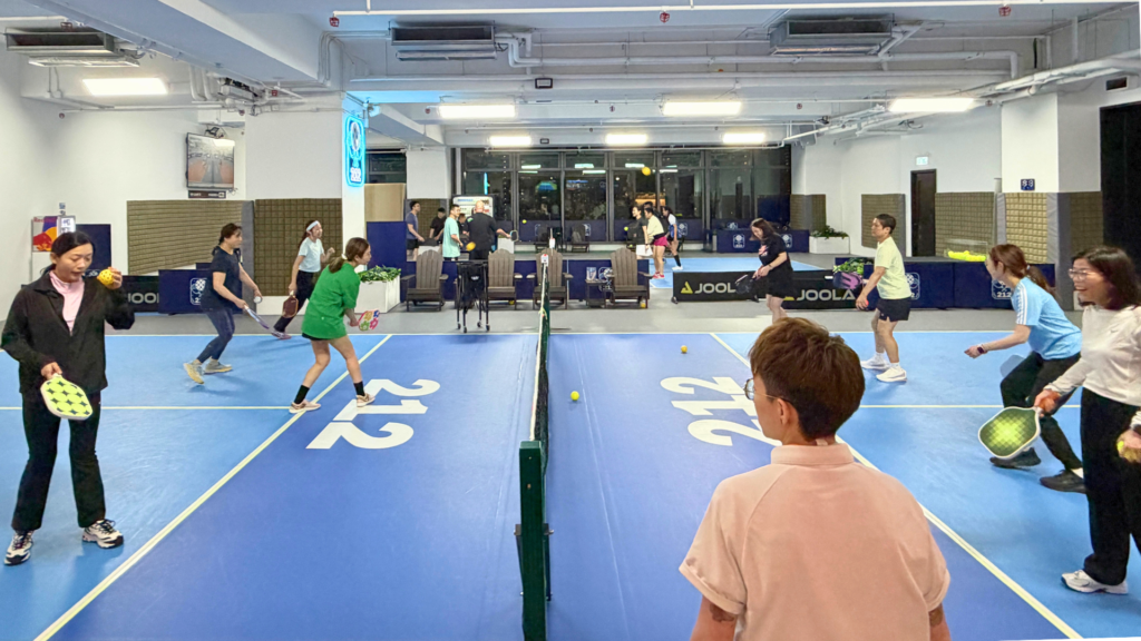 Players executing tactical dinking shots by following expert pickleball tips.